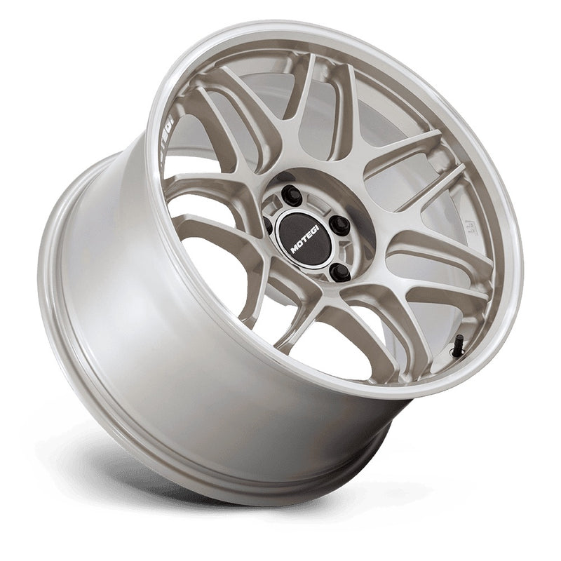 Tilted side view of a Motegi model Tsubake automotive wheel in motorsports gold with a machined lip and black motegi logo center cap