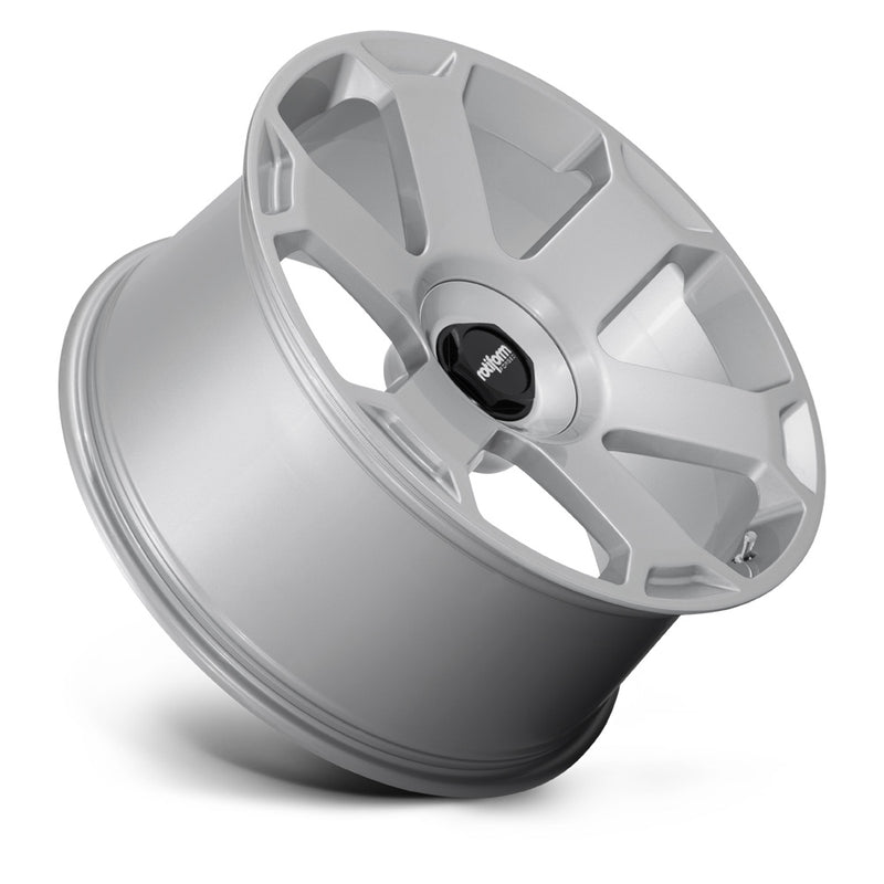 Tilted side view of a Rotiform AVS six spoke automotive wheel in gloss silver with black Rotiform logo center cap