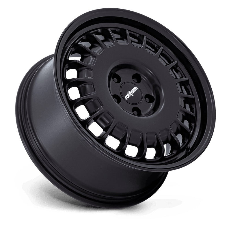 Tilted side view of a Rotiform PMF model vehicle road wheel in matter black with a sivler Rotiform logo onthe center cap